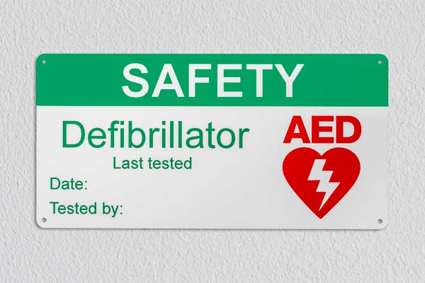 Safety sign, defibrillator